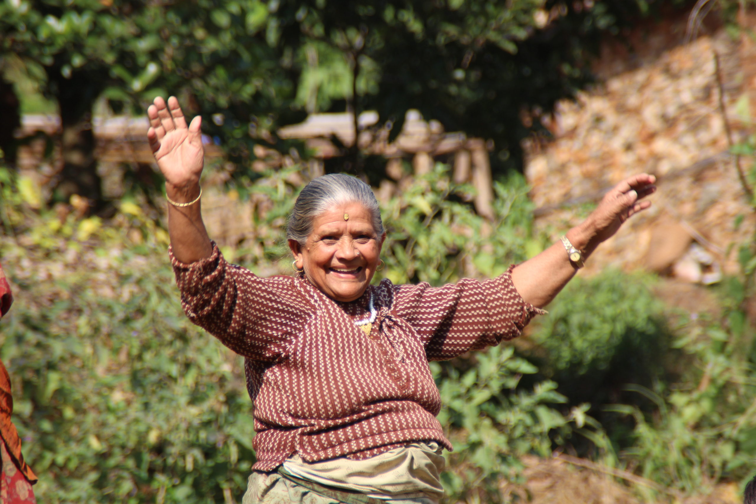 Happy lady with arms in the air